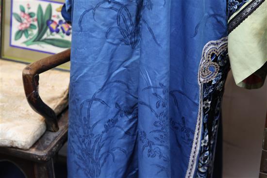 A Chinese blue silk, damask and embroidered ladys robe, late 19th / early 20th century,